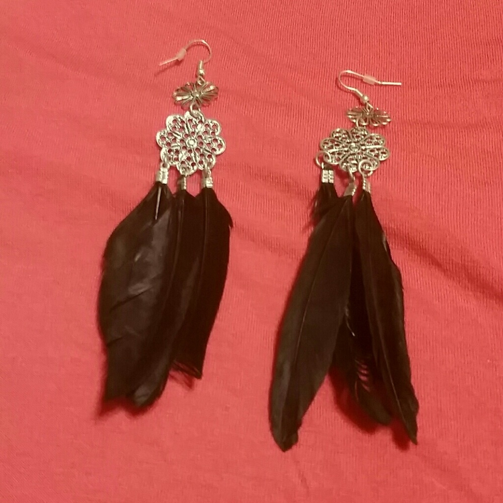 Black and silver feather earrings.  Never worn